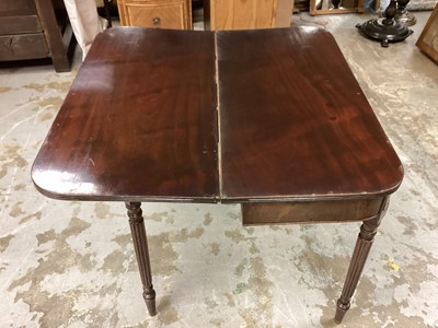 Lot 62 - 19th century mahogany tea table with foldover top on receded turned legs, 91cm wide, 44cm deep, 75cm high