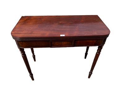 Lot 62 - 19th century mahogany tea table with foldover top on receded turned legs, 91cm wide, 44cm deep, 75cm high