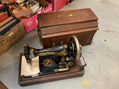 Lot 445 - Group of three Singer sewing machines including two in cases.