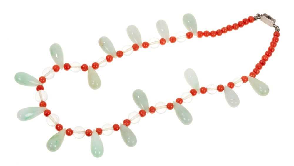 Lot 489 - Early 20th century Chinese jade and coral bead necklace and a Chinese carved jade pendant necklace (2)