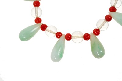 Lot 489 - Early 20th century Chinese jade and coral bead necklace and a Chinese carved jade pendant necklace (2)