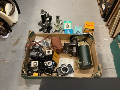 Lot 484 - Two microscopes, together with a group of cameras and accessories.