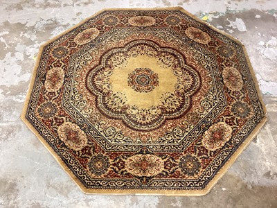 Lot 1217 - Small octagonal rug, 138cm, wall hanging and a two tier occasional table (3)