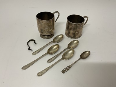 Lot 855 - Two silver christening mugs together with a group of silver spoons.