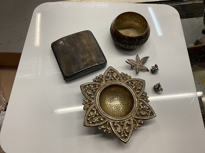 Lot 856 - Silver cigarette case and an eastern white metal tea strainer.