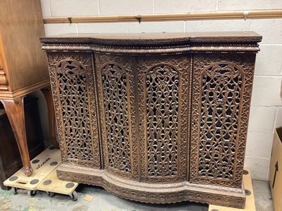 Lot 1231 - Antique eastern bowfront  bookcase with shelved interior enclosed by four ornately carved and pierced doors, 136cm wide, 47.5cm deep, 109.5cm high