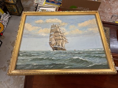 Lot 607 - Oil on canvas of a sailing ship at sea in gilt frame, together with a print of another ship. (2)