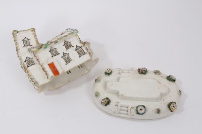 Lot 126 - A Staffordshire porcelain pastille burner and stand, in the form of a church with a crooked tower, circa 1850