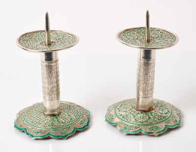 Lot 311 - Pair Chinese white metal and green enamel pricket candlesticks