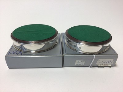 Lot 47 - Pair of sterling silver and turned wood bottle coasters in original Vogel boxes