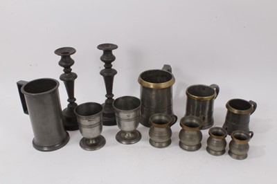 Lot 126 - Collection of pewter: Three brass rimmed tankards, one marked 'Battle of The Nile' Rotherhythe, two pairs brass rimmed belly 'Gill and 1/2 Gill', pair of pewter cups, French litre mug, pair candles...