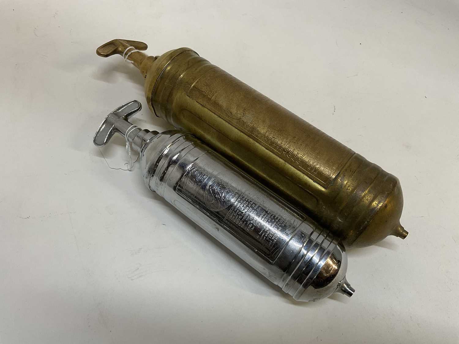 Pyrene Click Lot 2038 - Two brass and chrome vintage pyrene fire