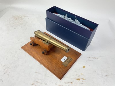 Lot 638 - Model Cannon on oak base with applied brass plaque named '32 pound deck gun of 1805' and model of HMS Belfast (2)