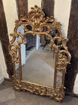 Lot 65 - French-style gilt wall mirror with carved and pierced scroll crestings and mirrored surround