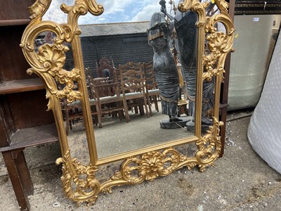 Lot 65 - French-style gilt wall mirror with carved and pierced scroll crestings and mirrored surround