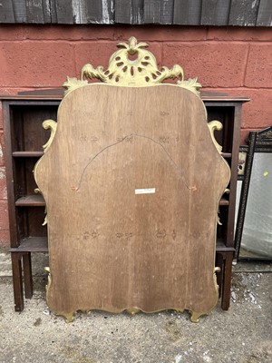 Lot 65 - French-style gilt wall mirror with carved and pierced scroll crestings and mirrored surround