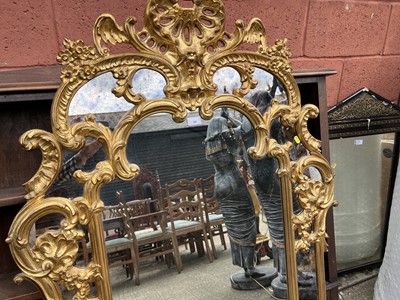 Lot 65 - French-style gilt wall mirror with carved and pierced scroll crestings and mirrored surround