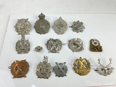 Lot 457 - Collection of fourteen Scottish military cap badges to include Argyll and Sutherland Highlanders, Cameron Highlanders and Scottish Horse, a mixture of reproduction and original badges noted.