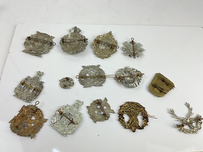 Lot 457 - Collection of fourteen Scottish military cap badges to include Argyll and Sutherland Highlanders, Cameron Highlanders and Scottish Horse, a mixture of reproduction and original badges noted.