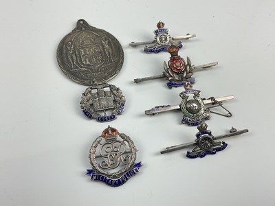 Lot 460 - Six silver and enamel military sweetheart brooches to include Royal Marines, Royal Artillery and Essex Regiment, together with a Masonic 1919 Peace medal (7)