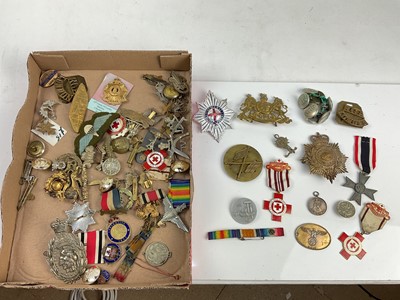 Lot 469 - Collection of military badges and buttons to include Nazi 1st May 1936, National Labour Day badge, Nazi War Merit Cross, British Red Cross Society medals and other badges.
