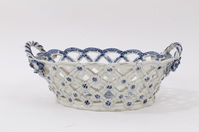 Lot 9 - 18th century Caughley porcelain blue and white chestnut basket decorated in the Pinecone pattern, with reticulated basket weave and applied handles and flowers.