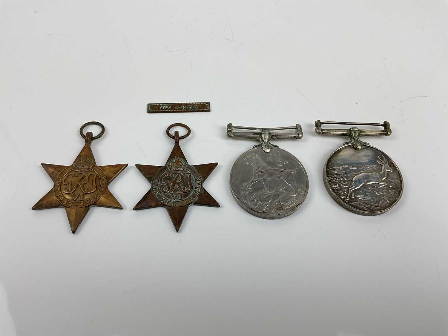 Lot 497 - Second World War South African medal group comprising 1939 -  1945 Star, Africa Star with 8th Army clasp, War medal and Africa Service medal, all named to 289485 D. Peterson.