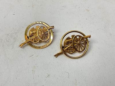 Lot 505 - Two First World War French yellow metal sweetheart brooches in the form of gun carriages, one marked Amiens 1914 - 1917 (2).