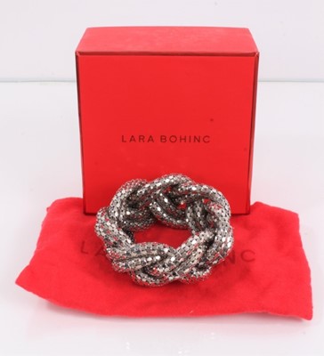Lot 801 - Lara Bohinc platinum plated large plait bracelet, in dust bag and box