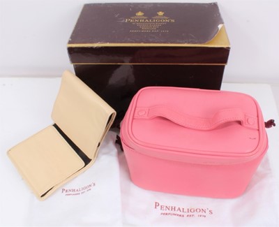 Lot 805 - Penhaligon's pink leather travel vanity case and cream leather travel jewellery wallet, both in dust bags, in one box