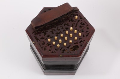 Lot 2200 - A good quality 30 key rosewood concertina with fretwork ends and bone keys, probably Lachenal, in original case