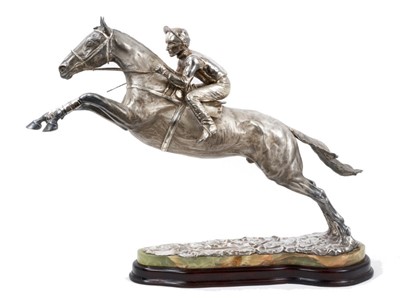 Lot 900 - A fine and highly impressive silver sculpture of Desert Orchid with Simon Sherwood up, realistically modelled rising for a jump