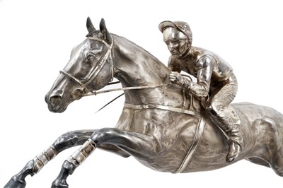 Lot 900 - A fine and highly impressive silver sculpture of Desert Orchid with Simon Sherwood up, realistically modelled rising for a jump