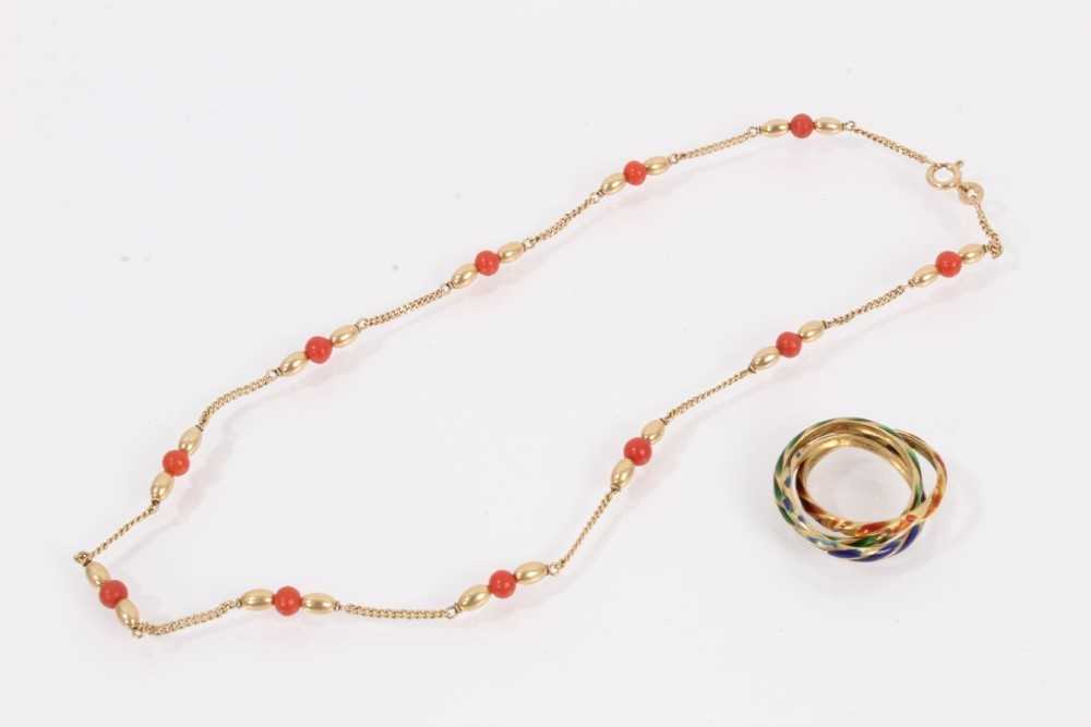 Lot 812 - 9ct gold chain interspaced with gold and coral beads and a yellow metal enamelled 'Russian' ring
