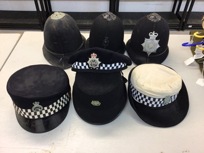 Lot 551 - Group of seven Elizabeth II Police helmets and hats for Royal Ulster Constabulary, Essex Police, The Metropolitan Police and others (1 box)