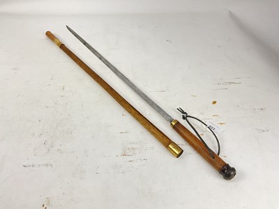 Lot 922 - 19th century Swordstick with tapered blade, turn horn knop and brass mounts 76cm