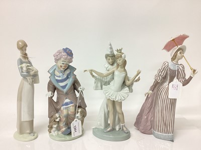 Lot 1201 - Four Lladro porcelain figures including Clown with three puppies and lady with parasol