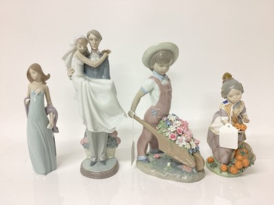 Lot 1202 - Four Lladro porcelain figures including married couple, and girl with oranges