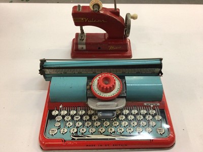 Lot 1886 - Box of toys including tin plate toy typewriter, Vulcan sewing machine, Beatrix Potter books, annuals and old roller skates.