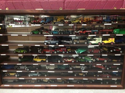 Lot 1806 - Two glazed front display cabinets with selection of model cars plus various Vanguard empty boxes (qty)