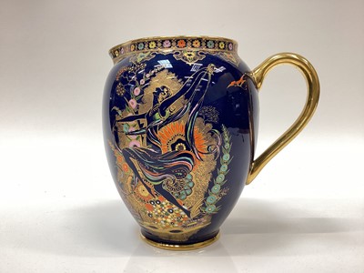 Lot 1268 - Gypsy a Carlton Ware jug pattern No. 3506 printed and painted in colours and gilt on a blue lustre ground