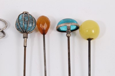 Lot 886 - Collection of twelve vintage hat pins including five silver pins by Charles Horner, three enamelled pins and four set with gem stones/ beads