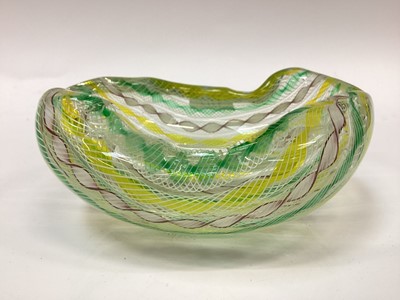 Lot 1272 - A Murano glass leaf shaped dish with pinched top rim alterate yellow, green, white canes cased in clear glass.  Together with a slim six sided panel glass with Murano labels