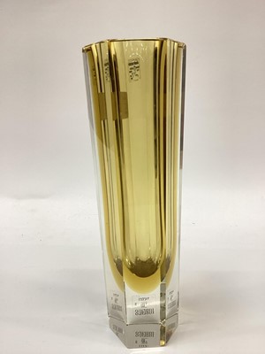 Lot 1272 - A Murano glass leaf shaped dish with pinched top rim alterate yellow, green, white canes cased in clear glass.  Together with a slim six sided panel glass with Murano labels