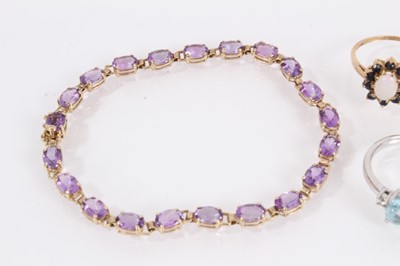 Lot 834 - Five 9ct gold gem set dress rings and 9ct gold gem set bracelet