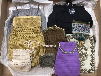 Lot 2103 - A group of Victorian handbags and purses, reticule bags include small micro bead bag with the Inital A, wool with meticallic couch stitching and Irish crochet.  Silver and enamel lilac bag, metal t...