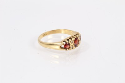 Lot 966 - 18ct gold garnet and diamond ring
