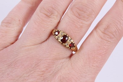 Lot 966 - 18ct gold garnet and diamond ring