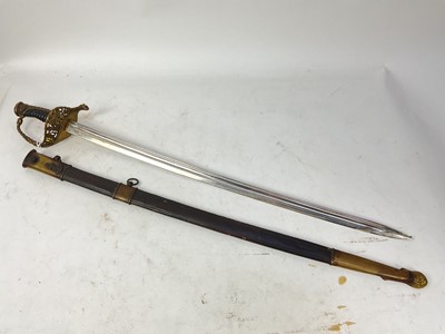 Lot 907 - Reproduction French Naval Officer's sword with ornate cast brass guard, fullered blade in brass mounted leather scabbard