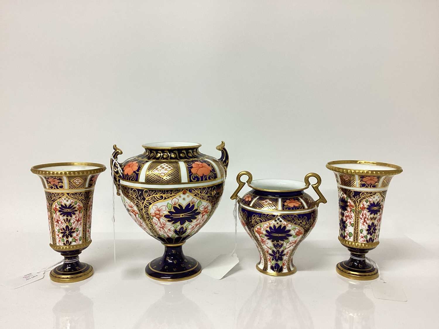 Lot 1198 - Two Royal Crown Derby Imari pattern vases, together with a twin handled vase and another (4)